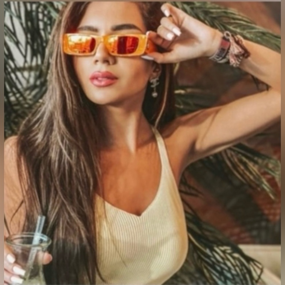 GUCCI UNISEX GUCCI FLUORESCENT ORANGE SUNGLASSES FOR A DRAMATIC POP OF COLOR